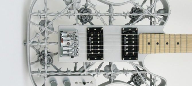 Heavy Metal: 3D printed aluminum guitar with barbed wires and roses
